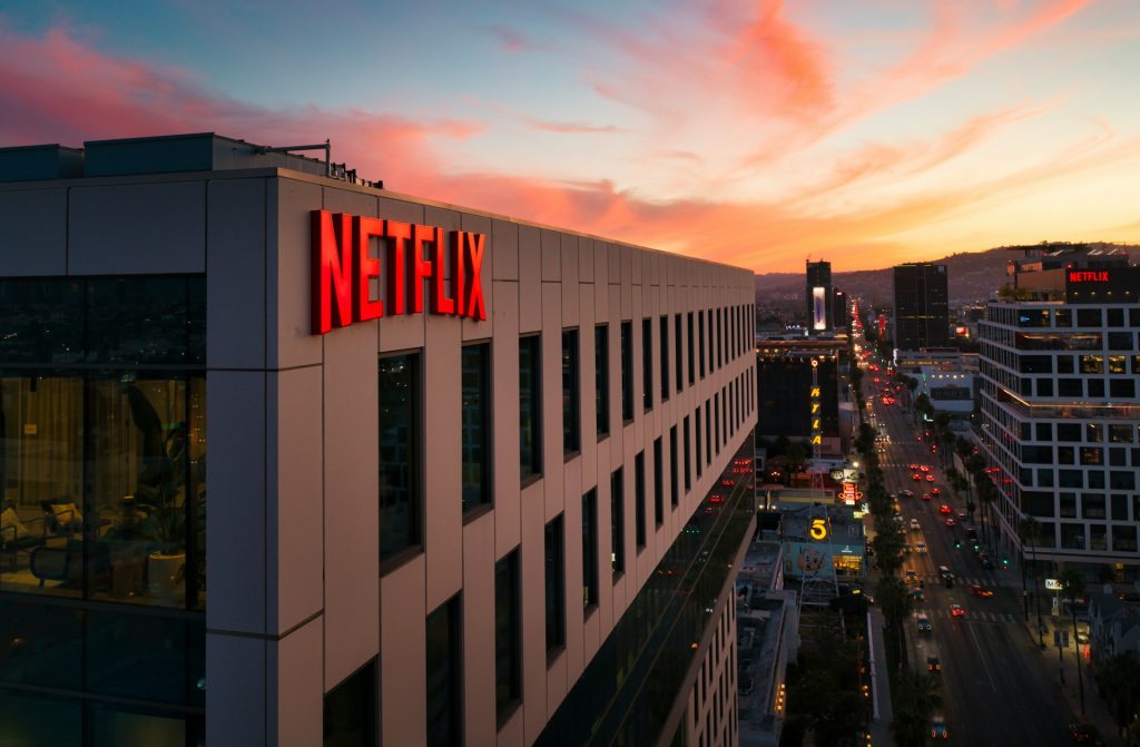 Netflix logo on a building at dusk